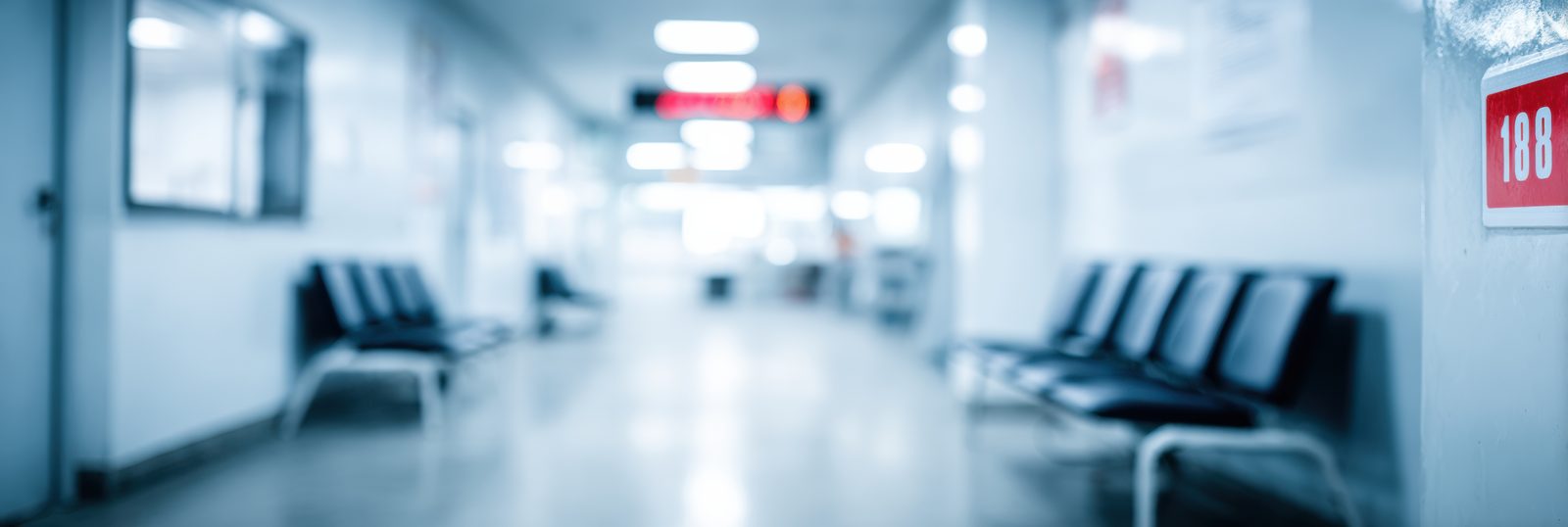 An empty hospital waiting room, illustrating the long wait to be seen